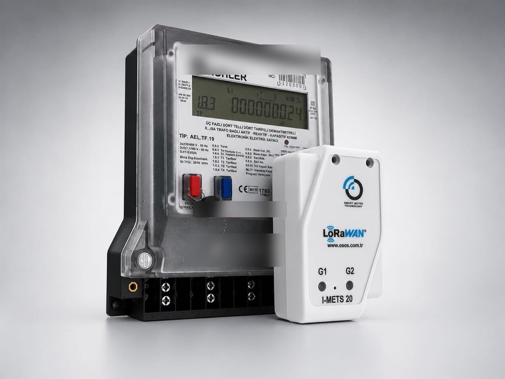 I-METS 20 module next to an existing Köhler electricity meter — actual size comparison